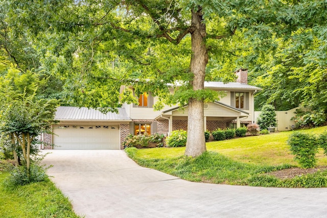 1920 Campbell Dr NW, Cleveland, TN 37312 - view of front facade with concrete driveway, brick siding, and a front lawn