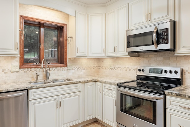 1920 Campbell Dr NW, Cleveland, TN 37312 - kitchen with appliances with stainless steel finishes, backsplash, light stone counters, and white cabinetry