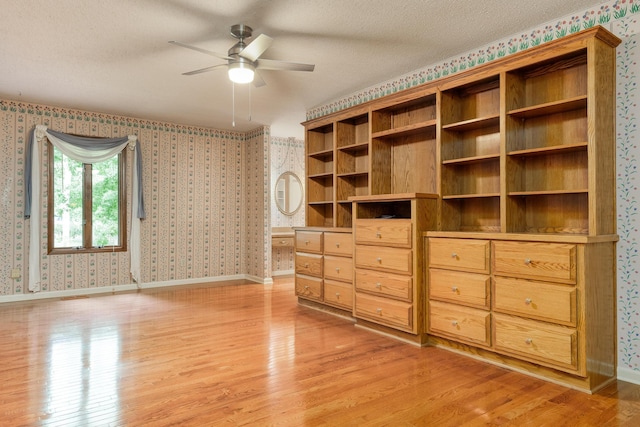 1920 Campbell Dr NW, Cleveland, TN 37312 - unfurnished bedroom with wallpapered walls, light wood finished floors, and a textured ceiling