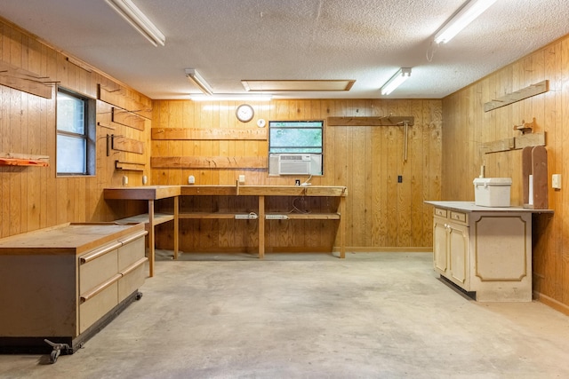 1920 Campbell Dr NW, Cleveland, TN 37312 - miscellaneous room featuring wood walls, a workshop area, a textured ceiling, concrete floors, and cooling unit