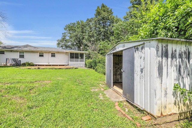 5506 Sunny Dell Ln, Chattanooga, TN 37412 - view of green lawn with a storage unit and a sunroom