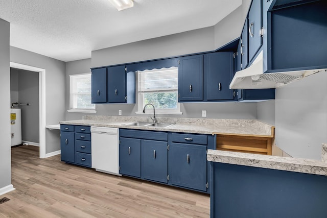 5506 Sunny Dell Ln, Chattanooga, TN 37412 - kitchen with white dishwasher, blue cabinetry, light countertops, light wood-style floors, and a textured ceiling