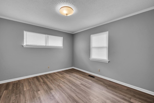 5506 Sunny Dell Ln, Chattanooga, TN 37412 - empty room with ornamental molding, a textured ceiling, wood finished floors, and plenty of natural light