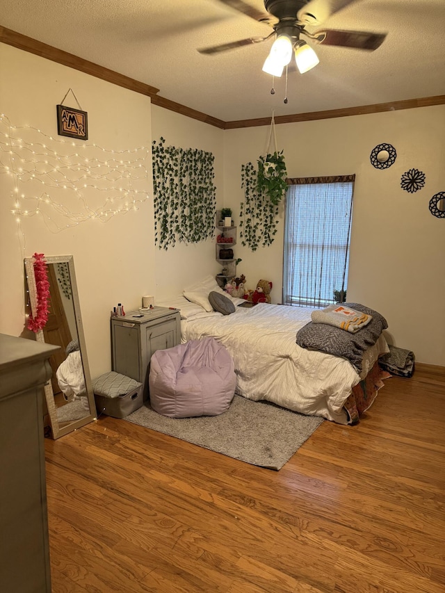 210 Laurel Ave, South Pittsburg, TN 37380 - bedroom with wood finished floors, crown molding, a textured ceiling, and ceiling fan
