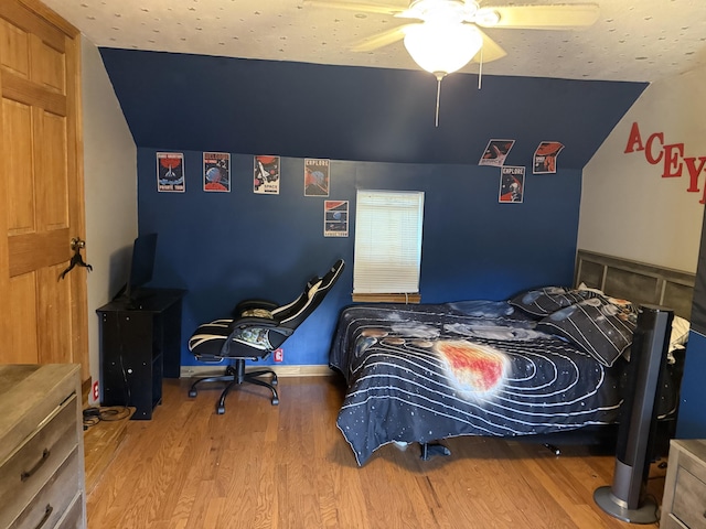 210 Laurel Ave, South Pittsburg, TN 37380 - bedroom with vaulted ceiling, wood finished floors, and a ceiling fan