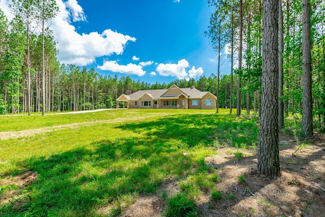 220 High Point Ln, Jasper, TN 37347 - view of front of house featuring a wooded view and a front yard