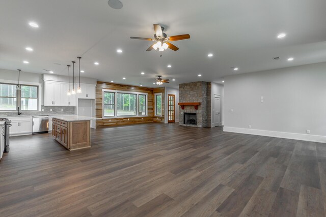 220 High Point Ln, Jasper, TN 37347 - kitchen featuring stainless steel appliances, open floor plan, ceiling fan, a fireplace, and white cabinets