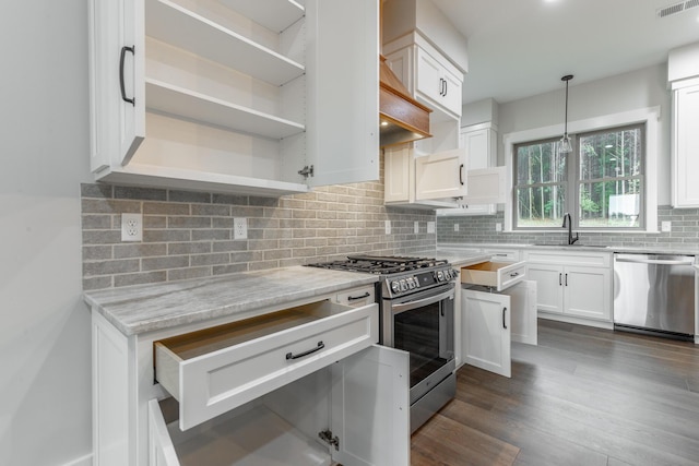 220 High Point Ln, Jasper, TN 37347 - kitchen featuring appliances with stainless steel finishes, open shelves, white cabinets, dark wood finished floors, and decorative backsplash