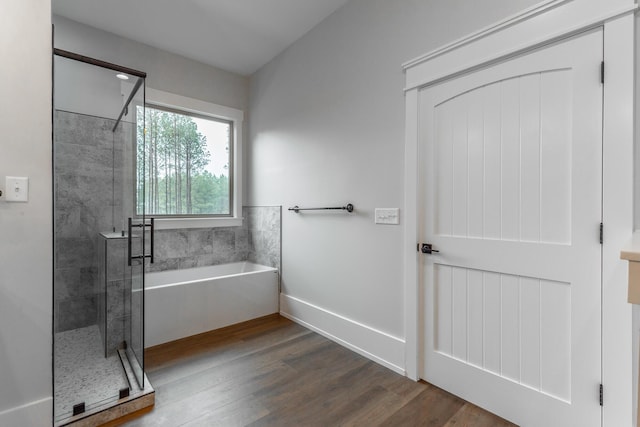 220 High Point Ln, Jasper, TN 37347 - full bath featuring a garden tub, a shower stall, and wood finished floors
