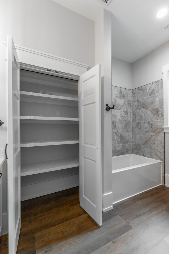 220 High Point Ln, Jasper, TN 37347 - bathroom with a tub to relax in and wood finished floors