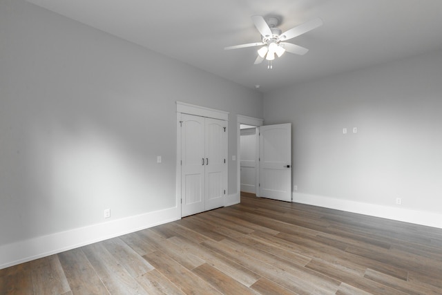 220 High Point Ln, Jasper, TN 37347 - unfurnished bedroom featuring wood finished floors, ceiling fan, and a closet