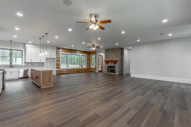 220 High Point Ln, Jasper, TN 37347 - kitchen featuring stainless steel appliances, open floor plan, ceiling fan, a fireplace, and white cabinets