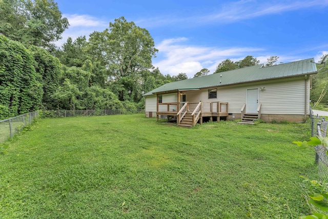 158 Bailey Cir SW, Cleveland, TN 37311 - rear view of property with a wooden deck, a fenced backyard, and a metal roof
