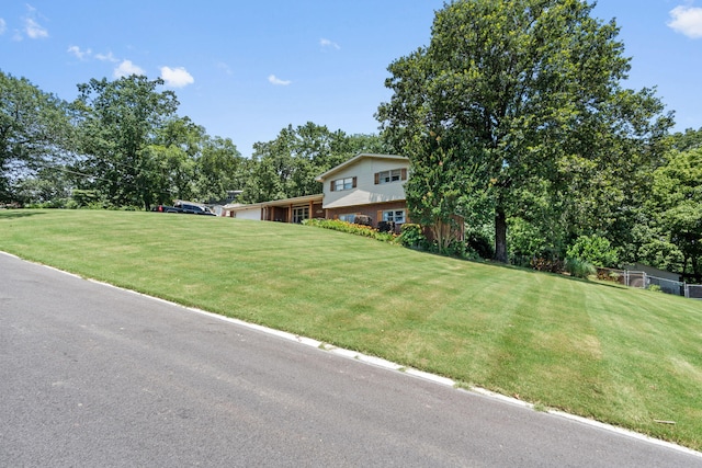 4522 Cloverdale Loop, Hixson, TN 37343 - split level home with a front lawn and view of scattered trees