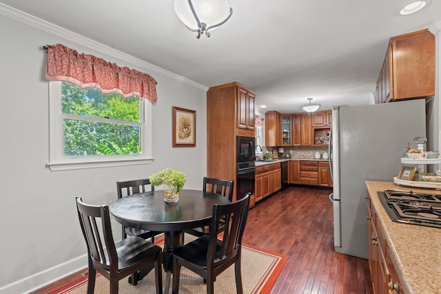 4522 Cloverdale Loop, Hixson, TN 37343 - dining area with dark wood finished floors, crown molding, and recessed lighting