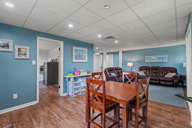 4522 Cloverdale Loop, Hixson, TN 37343 - dining space with wood finished floors, a paneled ceiling, and recessed lighting