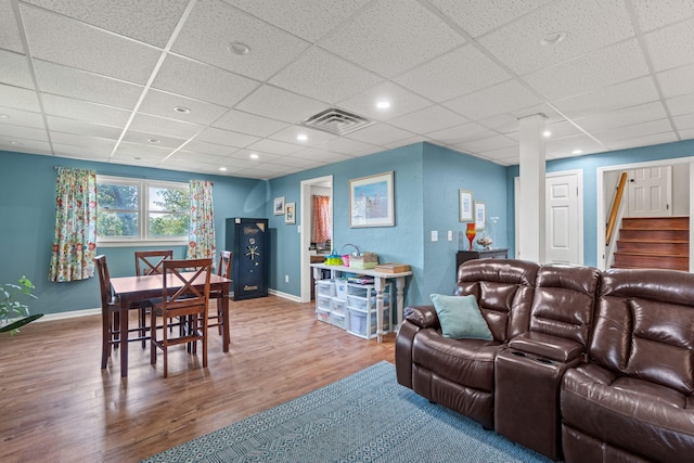 4522 Cloverdale Loop, Hixson, TN 37343 - dining space with wood finished floors, a drop ceiling, and stairs