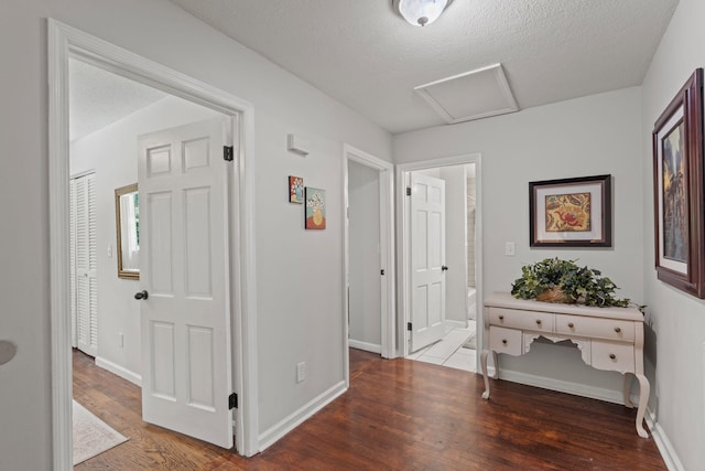4522 Cloverdale Loop, Hixson, TN 37343 - corridor featuring attic access, wood finished floors, and a textured ceiling