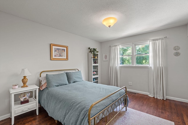 4522 Cloverdale Loop, Hixson, TN 37343 - bedroom with wood finished floors and a textured ceiling