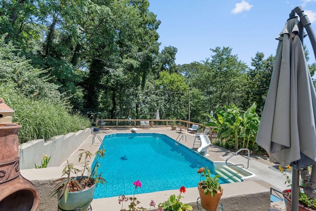 4522 Cloverdale Loop, Hixson, TN 37343 - view of pool with a patio, a diving board, and view of wooded area