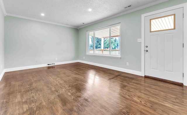 3010 Georgetown Dr NW, Cleveland, TN 37312 - entryway featuring wood finished floors, a textured ceiling, and ornamental molding