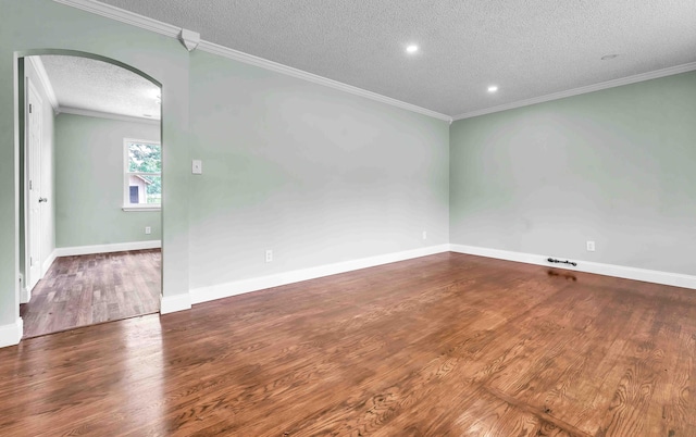 3010 Georgetown Dr NW, Cleveland, TN 37312 - spare room with a textured ceiling, arched walkways, wood finished floors, crown molding, and recessed lighting