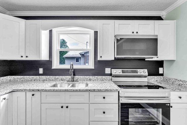 3010 Georgetown Dr NW, Cleveland, TN 37312 - kitchen with stainless steel appliances, white cabinetry, crown molding, a textured ceiling, and light stone counters