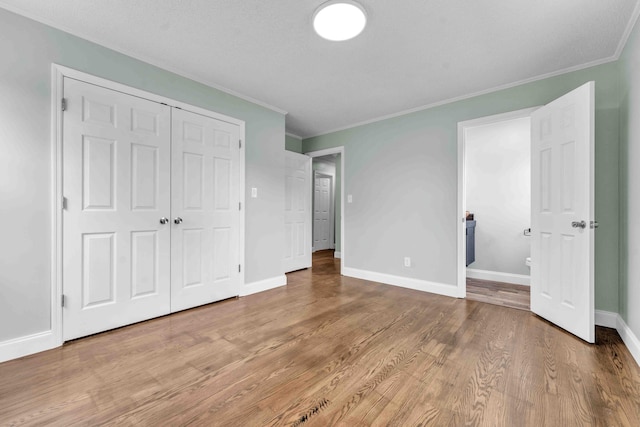 3010 Georgetown Dr NW, Cleveland, TN 37312 - unfurnished bedroom with crown molding, wood finished floors, and a closet