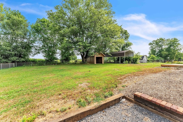 3010 Georgetown Dr NW, Cleveland, TN 37312 - view of yard featuring a detached carport and an outbuilding
