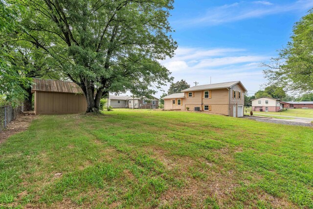 3010 Georgetown Dr NW, Cleveland, TN 37312 - view of yard with a garage and asphalt driveway