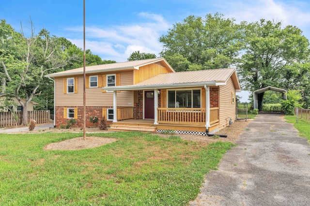 3010 Georgetown Dr NW, Cleveland, TN 37312 - split level home featuring covered porch, a detached carport, a metal roof, asphalt driveway, and brick siding