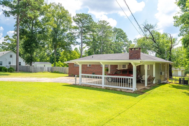 1318 Joiner Rd, Chattanooga, TN 37421 - back of house with a patio area, a chimney, brick siding, and dirt driveway