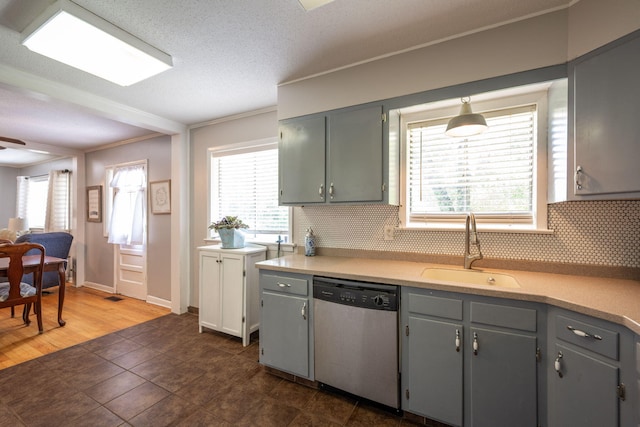 1318 Joiner Rd, Chattanooga, TN 37421 - kitchen featuring stainless steel dishwasher, tasteful backsplash, ornamental molding, gray cabinets, and light countertops