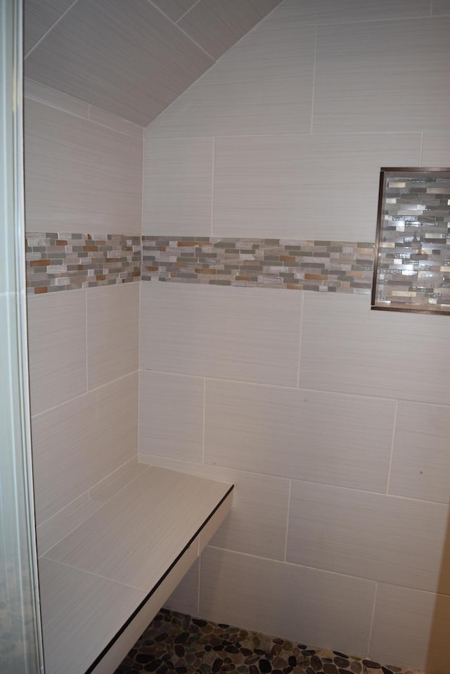 81 Morning Mist Dr, Rossville, GA 30741 - bathroom featuring a tile shower and lofted ceiling
