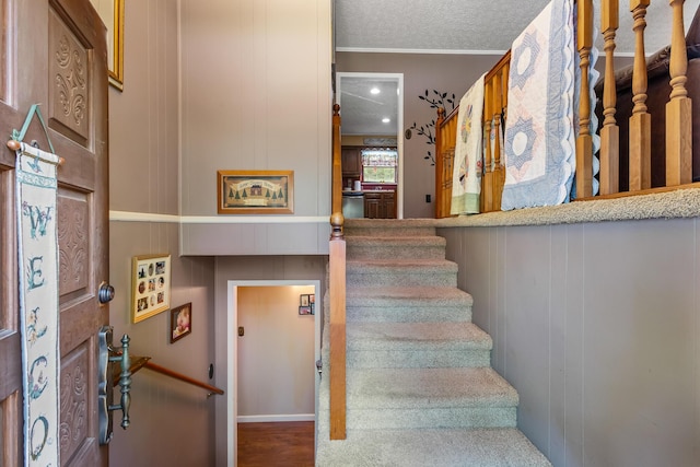 144 Bible Dr, Benton, TN 37307 - stairs with ornamental molding and a textured ceiling