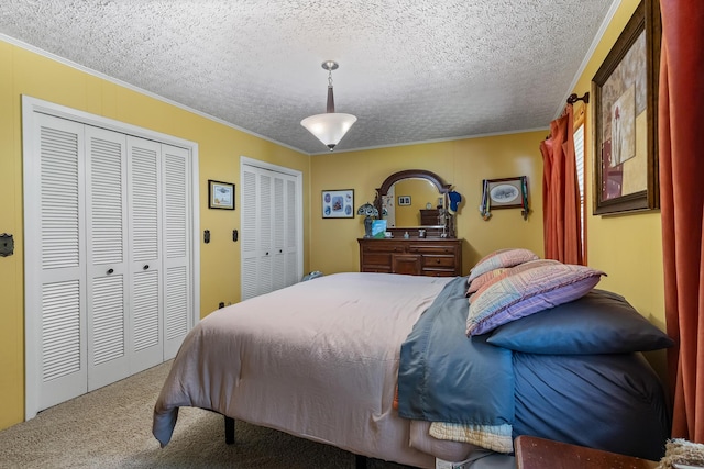 144 Bible Dr, Benton, TN 37307 - bedroom featuring carpet, multiple closets, ornamental molding, and a textured ceiling