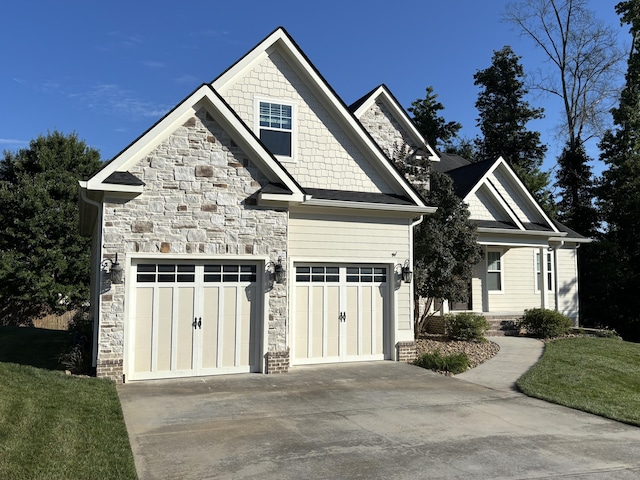 4138 Lone Elm Ln, Apison, TN 37302 - view of front of house featuring concrete driveway, stone siding, a front lawn, and an attached garage
