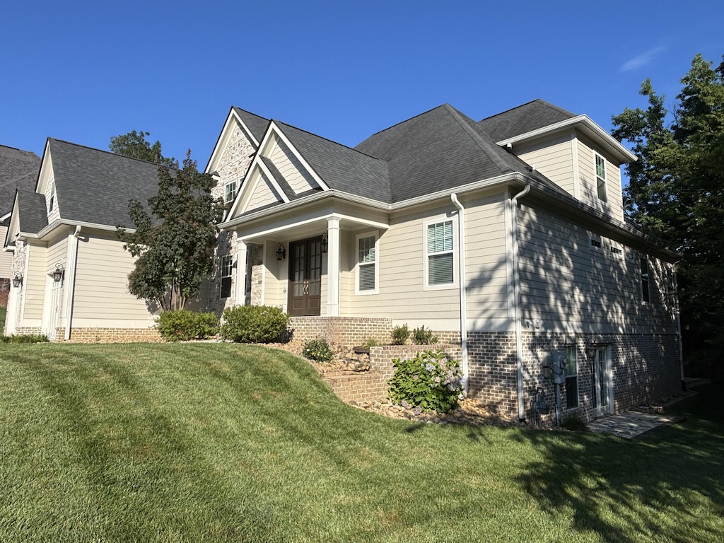 4138 Lone Elm Ln, Apison, TN 37302 - view of front of home with a front lawn and roof with shingles