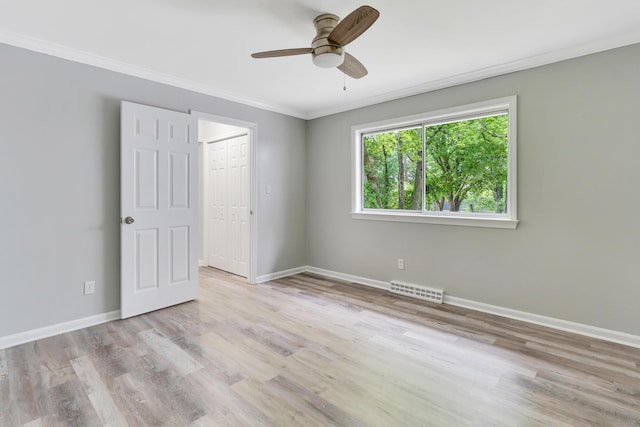 4212 Rogers Rd, Chattanooga, TN 37411 - unfurnished bedroom with ornamental molding, wood finished floors, ceiling fan, and a closet