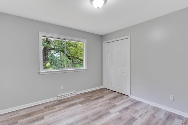 4212 Rogers Rd, Chattanooga, TN 37411 - unfurnished bedroom with light wood-style flooring and a closet
