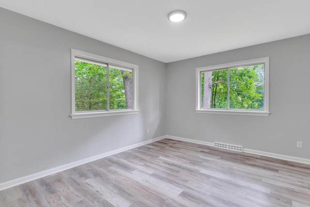 4212 Rogers Rd, Chattanooga, TN 37411 - empty room with healthy amount of natural light and wood finished floors