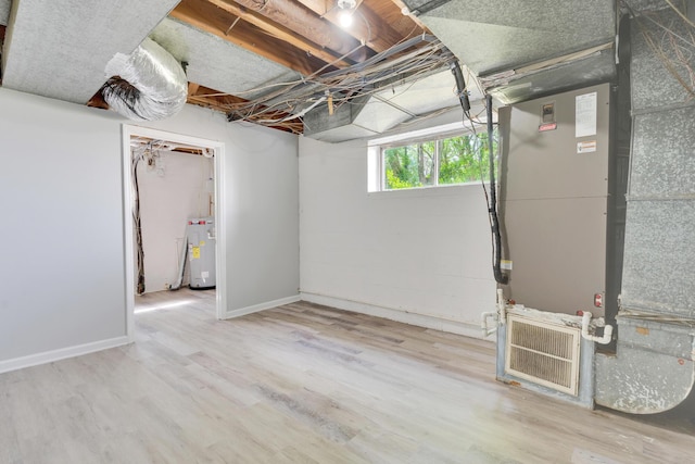 4212 Rogers Rd, Chattanooga, TN 37411 - basement featuring water heater and wood finished floors