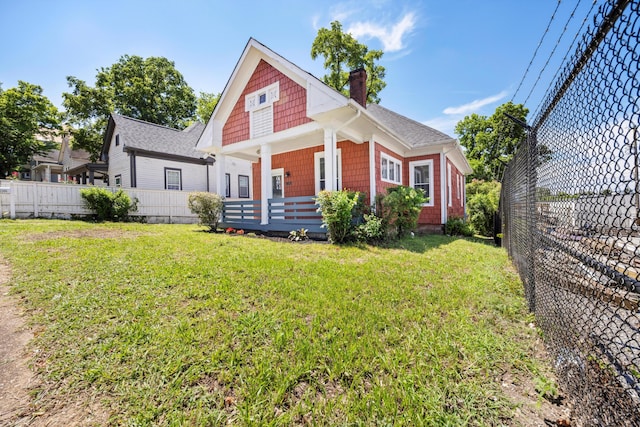 1306 Bailey Ave, Chattanooga, TN 37404 - view of front of house featuring a chimney, covered porch, and a shingled roof