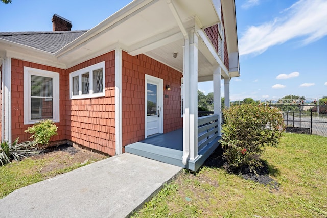 1306 Bailey Ave, Chattanooga, TN 37404 - view of side of property featuring a chimney, a porch, and a shingled roof