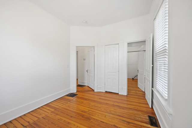 1306 Bailey Ave, Chattanooga, TN 37404 - unfurnished bedroom with hardwood / wood-style flooring and baseboards