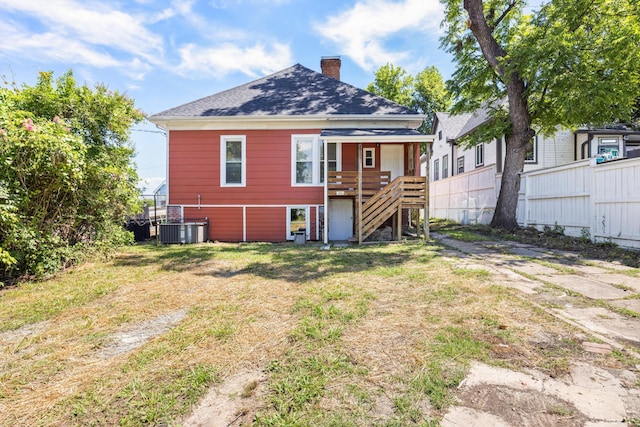 1306 Bailey Ave, Chattanooga, TN 37404 - rear view of house with a chimney, stairway, and roof with shingles