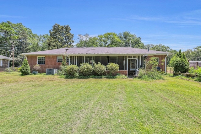 353 Prater Rd, Rossville, GA 30741 - back of house with brick siding, a sunroom, and a lawn