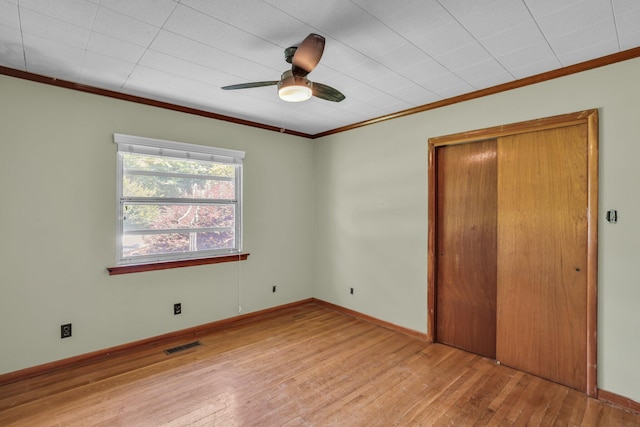 353 Prater Rd, Rossville, GA 30741 - unfurnished bedroom featuring wood-type flooring, ornamental molding, a closet, and a ceiling fan