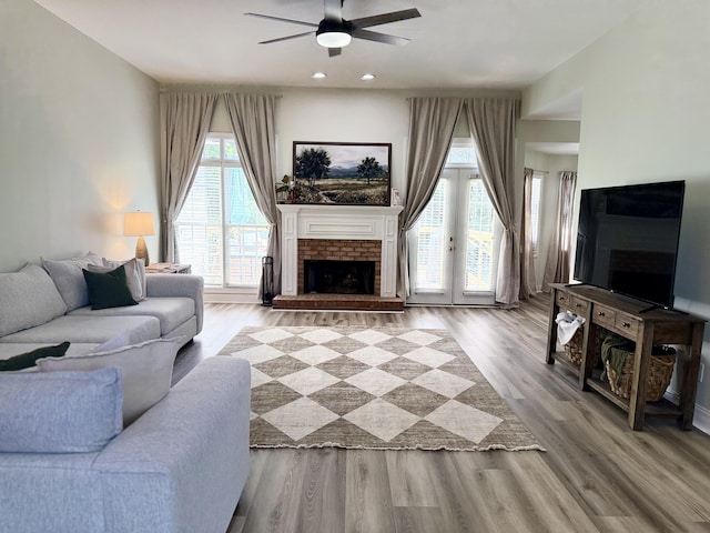 120 Oakhurst Ter NE, Calhoun, GA 30701 - living area featuring ceiling fan, wood finished floors, plenty of natural light, a fireplace, and recessed lighting