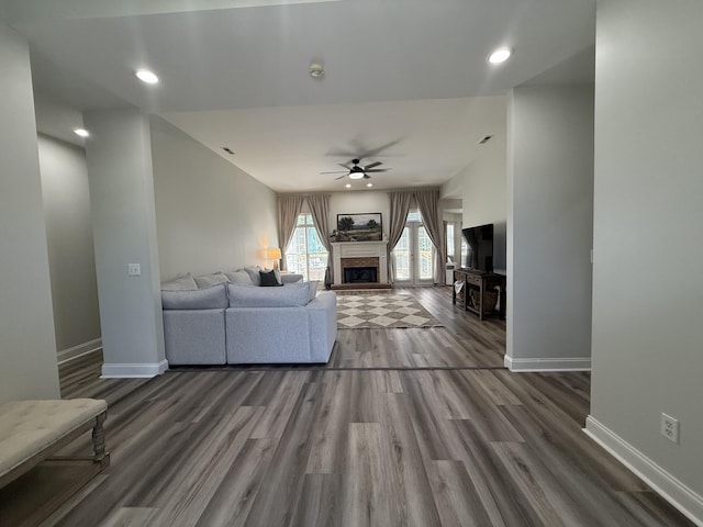 120 Oakhurst Ter NE, Calhoun, GA 30701 - living area with a ceiling fan, a fireplace with raised hearth, wood finished floors, and recessed lighting